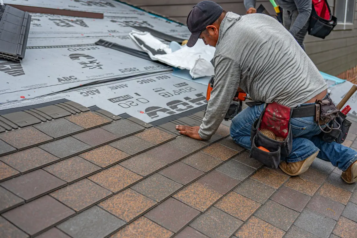 Synthetic underlayment rows installed beneath new shingles